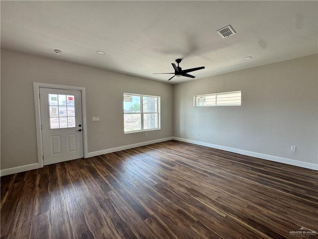foyer with visible vents, baseboards, ceiling fan, and dark wood finished floors