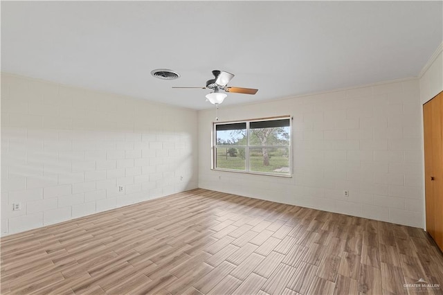 unfurnished room featuring light hardwood / wood-style flooring and ceiling fan