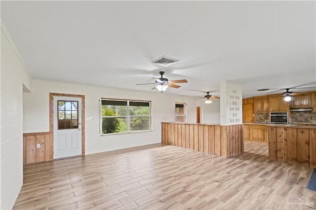 unfurnished living room featuring light hardwood / wood-style floors