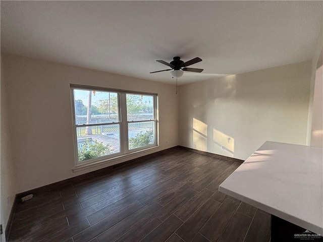1060 Timothy St, San Benito, TX 78586 - unfurnished room featuring dark wood finished floors and ceiling fan
