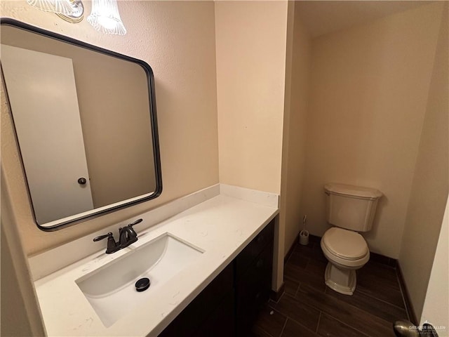 1060 Timothy St, San Benito, TX 78586 - half bath featuring vanity and wood finish floors