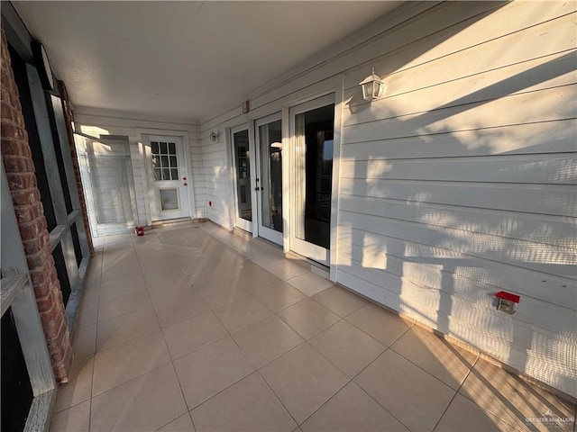 1060 Timothy St, San Benito, TX 78586 - unfurnished sunroom featuring french doors