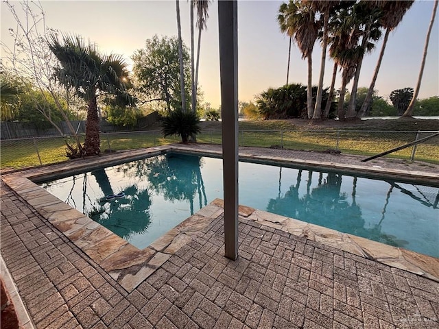 1060 Timothy St, San Benito, TX 78586 - view of swimming pool with a fenced backyard and a patio