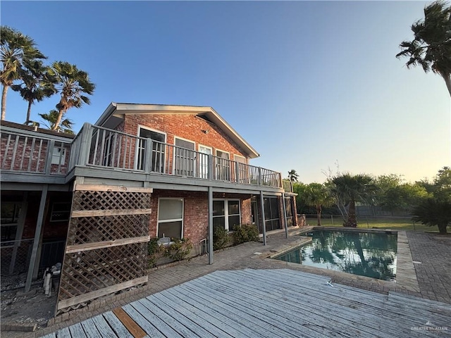 1060 Timothy St, San Benito, TX 78586 - outdoor pool featuring a wooden deck