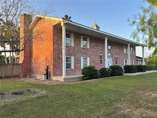 1060 Timothy St, San Benito, TX 78586 - view of front of home with a chimney and brick siding