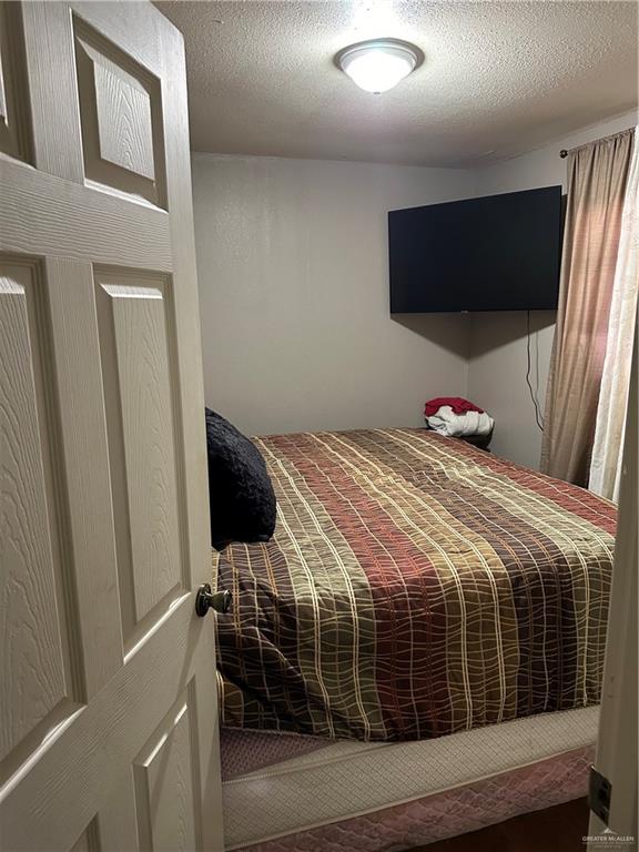 bedroom featuring a textured ceiling