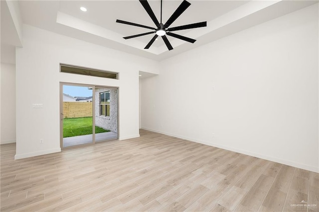 3508 E Kidd Ave, Edinburg, TX 78542 - spare room with a raised ceiling, light wood-style floors, baseboards, recessed lighting, and a ceiling fan