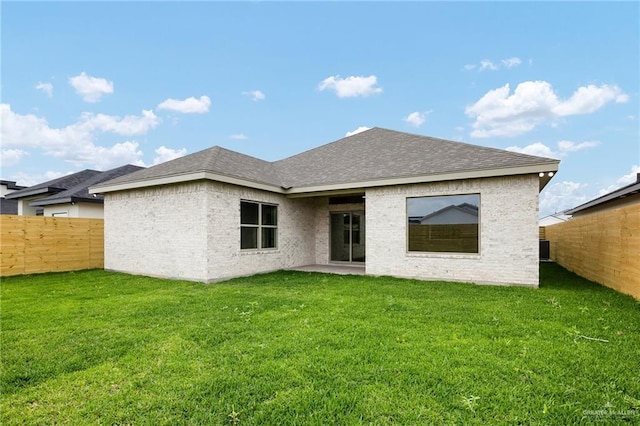 3508 E Kidd Ave, Edinburg, TX 78542 - back of property with roof with shingles, brick siding, and a patio