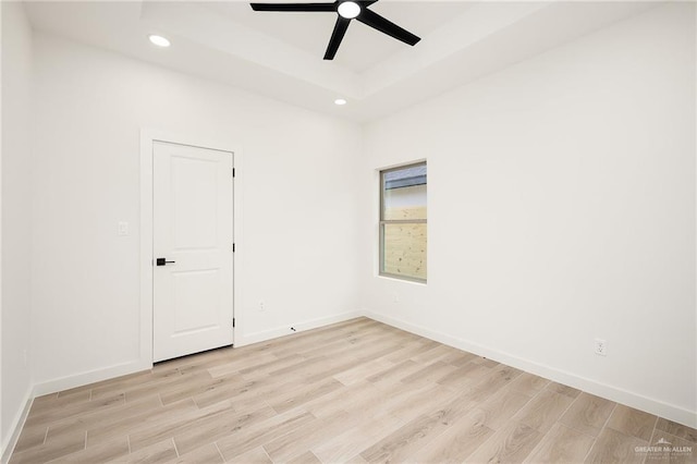 3508 E Kidd Ave, Edinburg, TX 78542 - unfurnished room with light wood finished floors, ceiling fan, recessed lighting, baseboards, and a raised ceiling