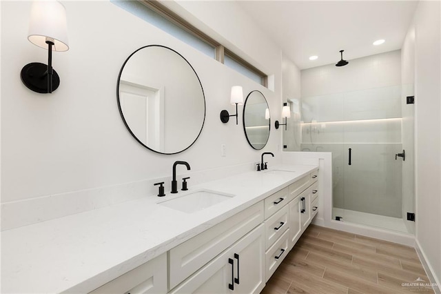 3508 E Kidd Ave, Edinburg, TX 78542 - full bath with double vanity, a stall shower, recessed lighting, and wood finished floors
