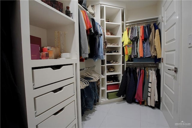 spacious closet with light tile patterned floors