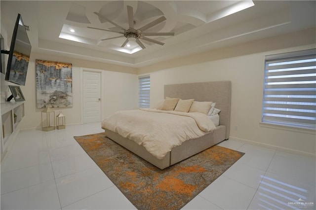 bedroom featuring light tile patterned floors, baseboards, coffered ceiling, and ceiling fan