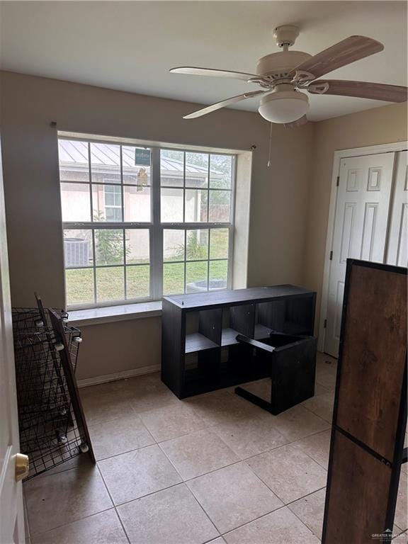 dining room with ceiling fan and light tile patterned floors