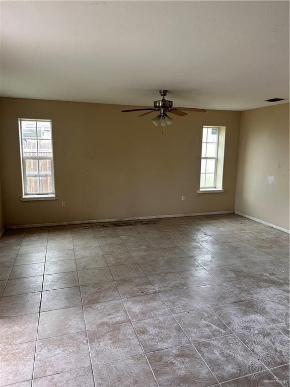 unfurnished room featuring ceiling fan