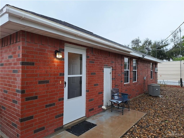 back of house with a patio and cooling unit