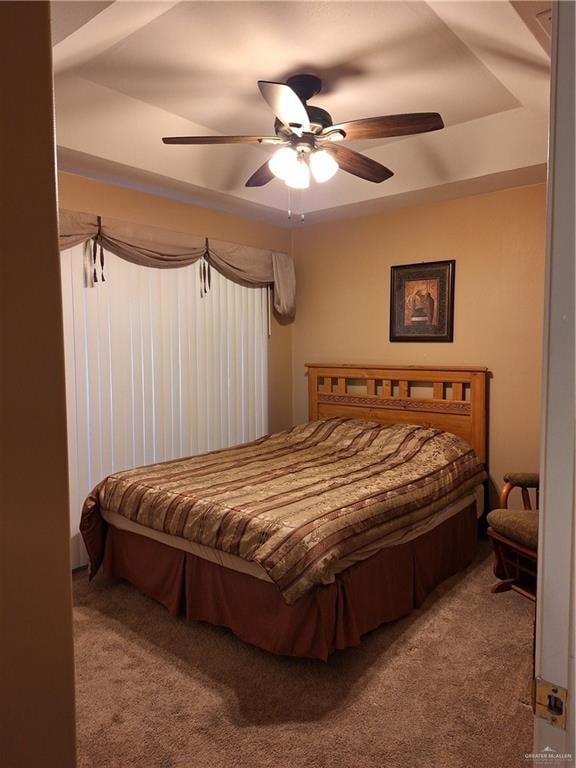 bedroom featuring ceiling fan and carpet floors