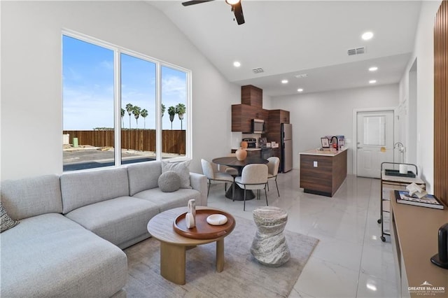 living room featuring lofted ceiling and ceiling fan