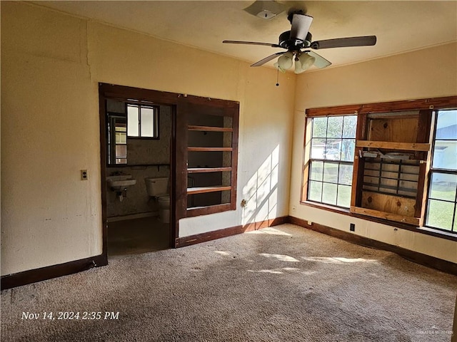 carpeted empty room with ceiling fan