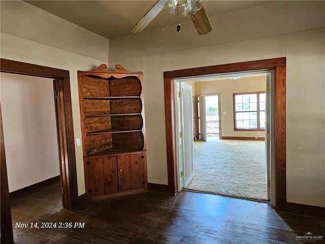 hallway with dark wood-type flooring