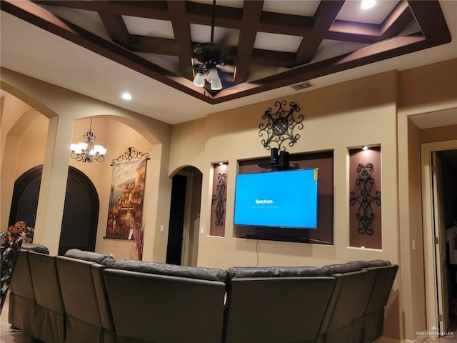 cinema room featuring a ceiling fan, visible vents, coffered ceiling, recessed lighting, and arched walkways