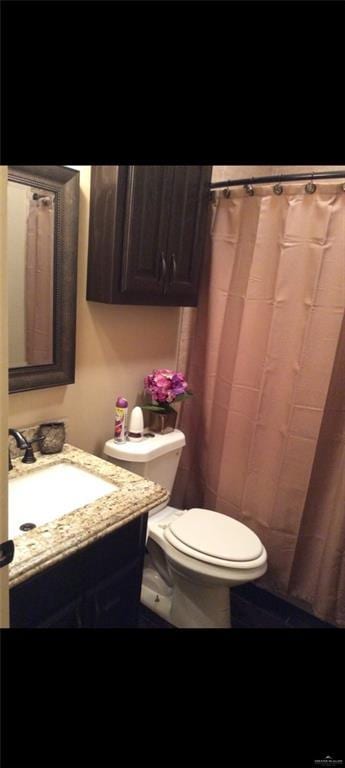 bathroom with vanity and toilet