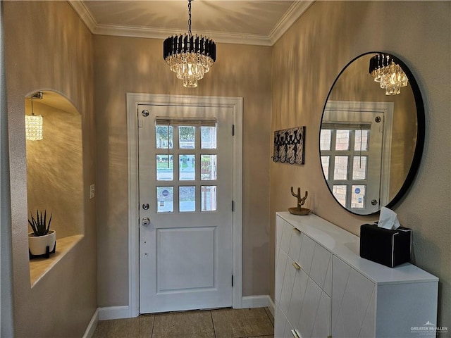 doorway to outside with baseboards, ornamental molding, and an inviting chandelier