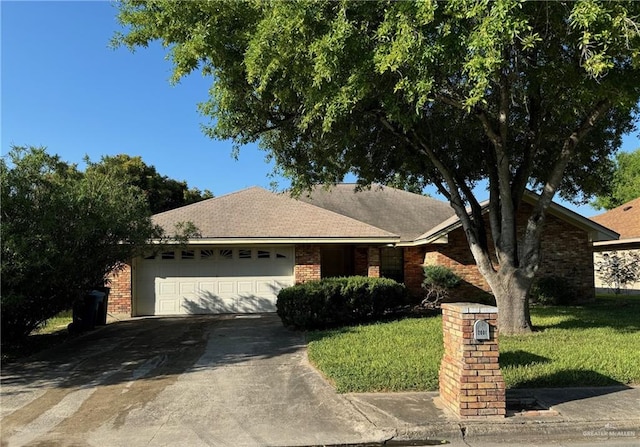 ranch-style house with a garage and a front lawn