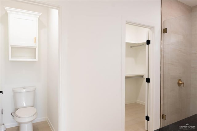 2221 N Woody St, Edinburg, TX 78541 - full bathroom featuring a shower stall and a walk in closet