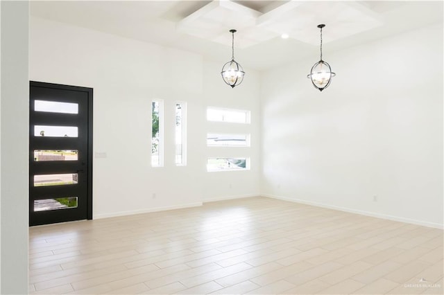 2221 N Woody St, Edinburg, TX 78541 - foyer with coffered ceiling, beamed ceiling, and a chandelier