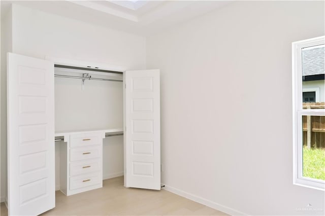 2221 N Woody St, Edinburg, TX 78541 - unfurnished bedroom with light wood-type flooring and a closet