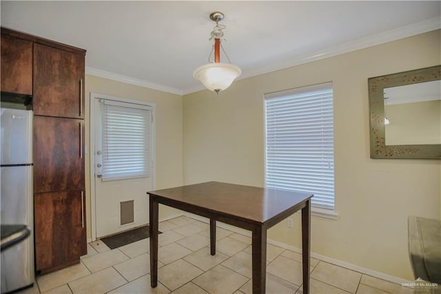 3008 S M St Unit 4, Mcallen, TX 78503 - dining room featuring ornamental molding, baseboards, healthy amount of natural light, and light tile patterned flooring