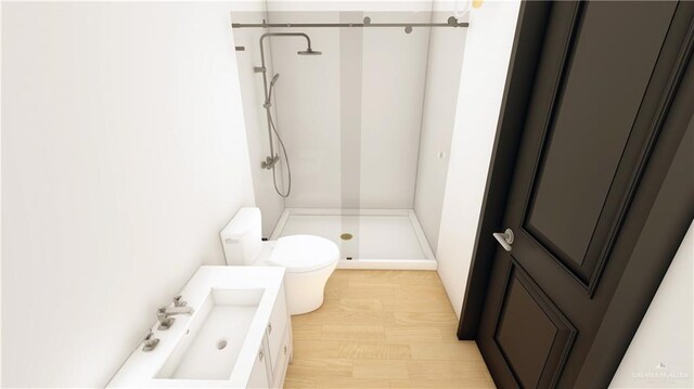 3 Washmon Ave, Harlingen, TX 78552 - bathroom with vanity, toilet, wood-type flooring, and walk in shower