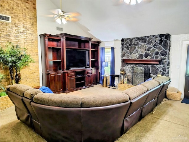 702 Clifford Dr, Weslaco, TX 78596 - carpeted living room featuring ceiling fan, lofted ceiling, and a stone fireplace