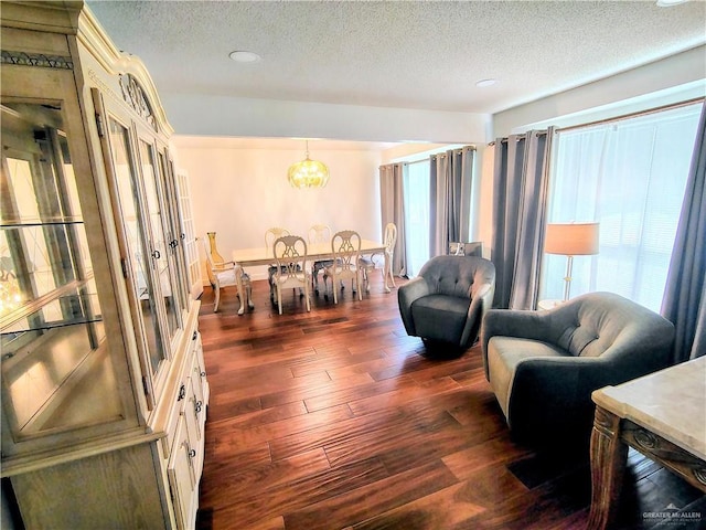 702 Clifford Dr, Weslaco, TX 78596 - living area featuring a textured ceiling, dark wood finished floors, a chandelier, and recessed lighting