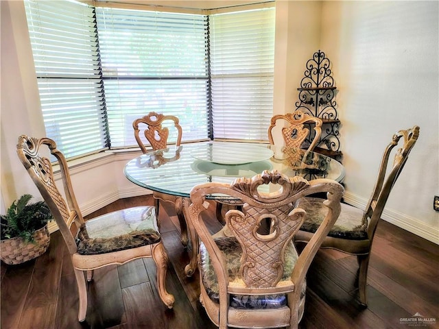 702 Clifford Dr, Weslaco, TX 78596 - dining space with baseboards and wood finished floors
