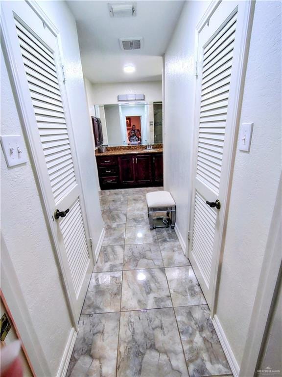 702 Clifford Dr, Weslaco, TX 78596 - hall with light marble finish floors and baseboards