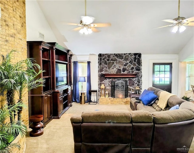 702 Clifford Dr, Weslaco, TX 78596 - living area with a fireplace, lofted ceiling, ceiling fan, and light carpet