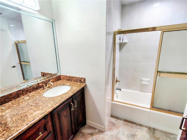 702 Clifford Dr, Weslaco, TX 78596 - bathroom with vanity and shower / bath combination with glass door