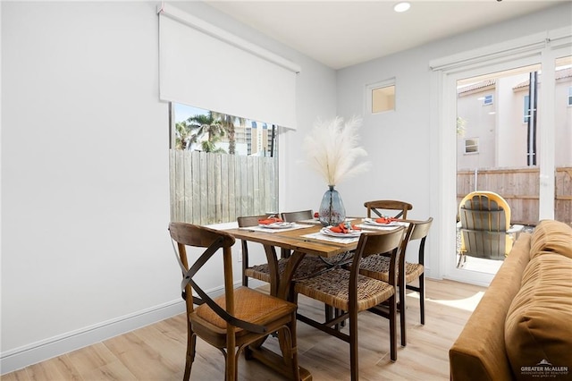 dining area featuring light wood-type flooring