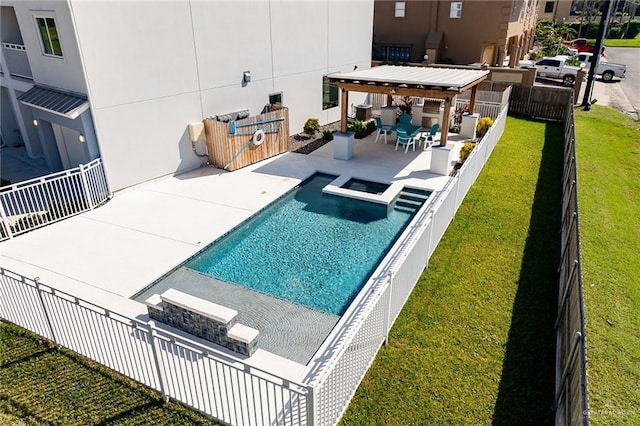 view of swimming pool with an in ground hot tub, a yard, and a patio