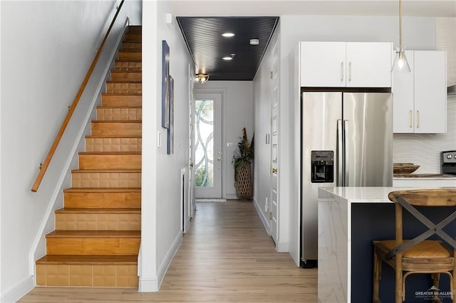 stairway with wood-type flooring