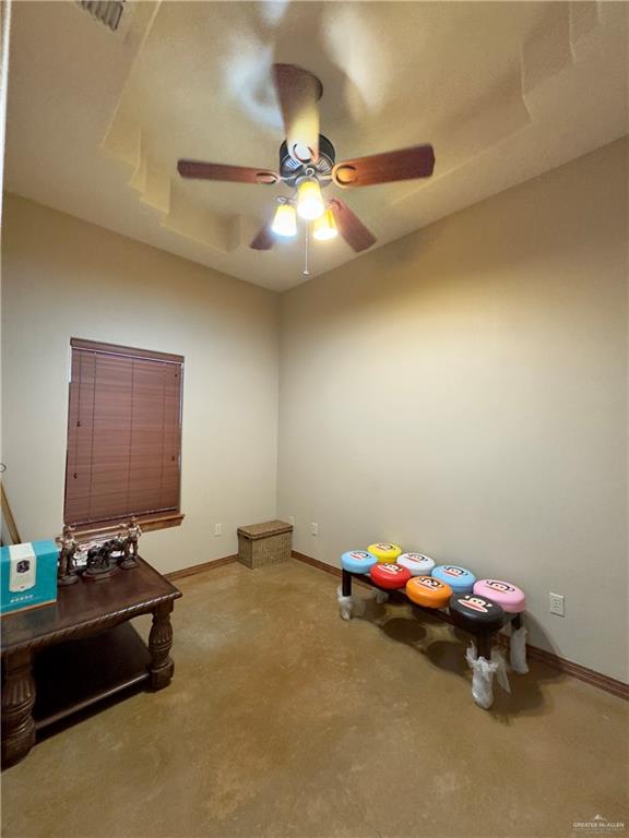 miscellaneous room featuring ceiling fan and light colored carpet