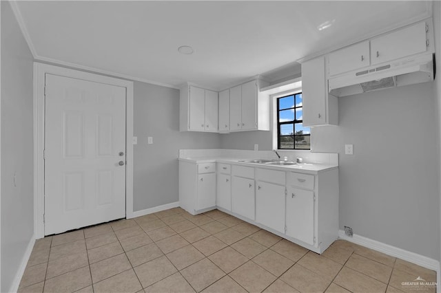 kitchen with white cabinetry, sink, and light tile patterned floors