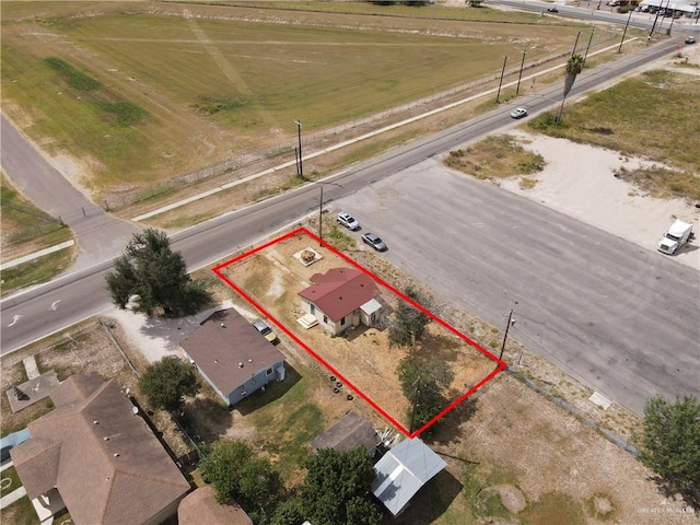 birds eye view of property featuring a rural view