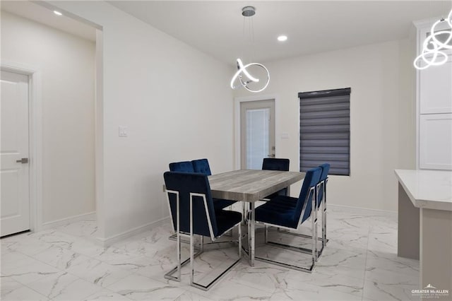 1921 Lime St, San Juan, TX 78589 - dining space featuring light marble finish flooring, recessed lighting, baseboards, and a chandelier