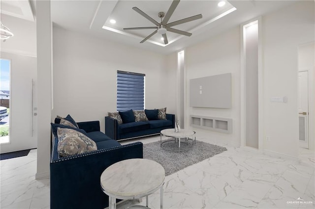 1921 Lime St, San Juan, TX 78589 - living area featuring a ceiling fan, a tray ceiling, marble finish floors, and recessed lighting