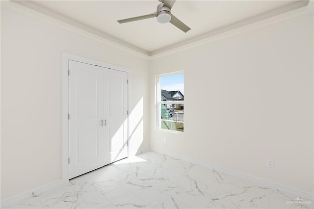 1921 Lime St, San Juan, TX 78589 - unfurnished bedroom featuring light marble finish flooring, baseboards, ornamental molding, ceiling fan, and a closet