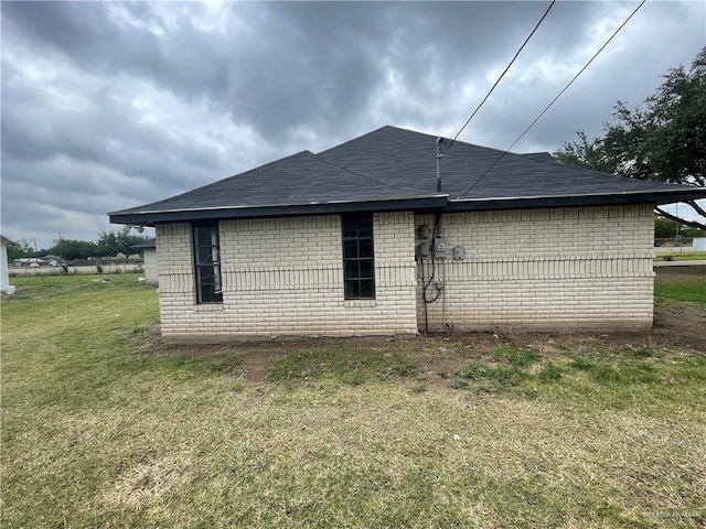 view of home's exterior with a yard