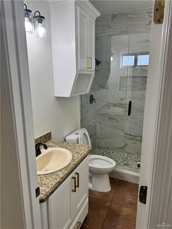 bathroom with tile patterned flooring, vanity, toilet, and a shower with door