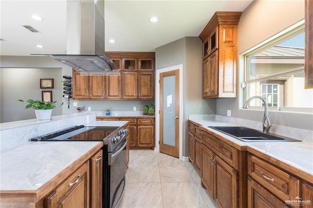 kitchen with island range hood, sink, and stainless steel electric range